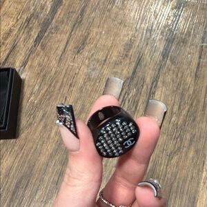 CHANEL Black Ring with Silver Detailing